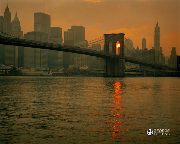 Iconic NY vista twilight, view of Brooklyn Bridge with Manhattan behind