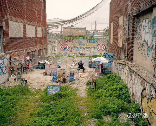 Coney Island board walk side show attraction shoot the running man