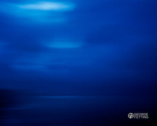 A single shaft of light breaks through the clouds