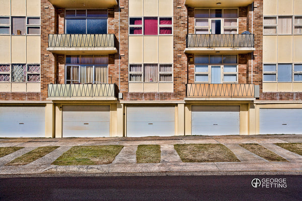 Geometric lines of an ageing Sydney unit block complete with doll