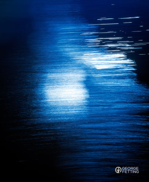 Flashes of sunlight streaking on water 